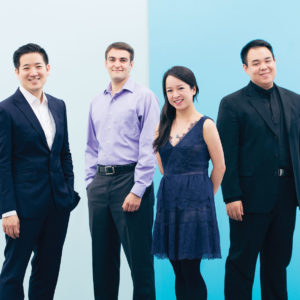 A portrait featuring the four members of the Afiara String Quartet against a light blue background.